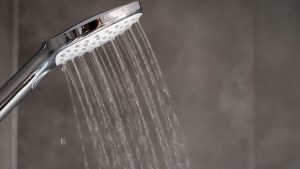 Showerhead with steam in the background